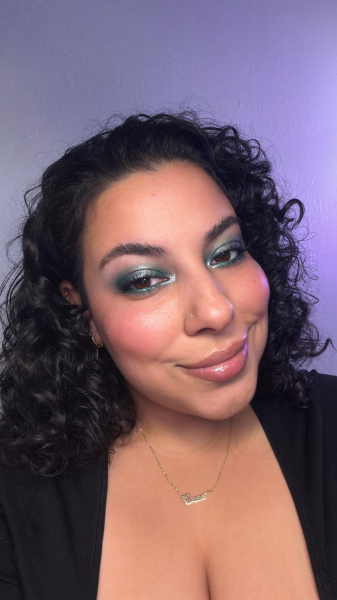 photo of woman wearing blue and green eye shadow and eyeliner