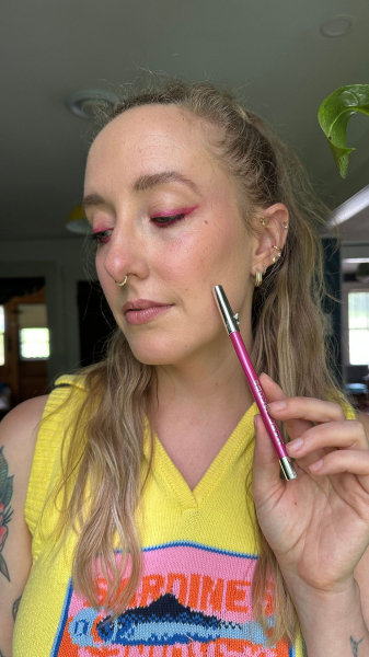 photo of woman wearing pink eyeliner